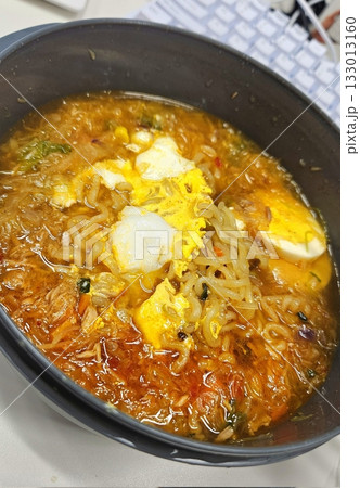 Shin Ramyun,close up of Ramyeon or Ramyun is a Korean-style soup noodle dish with a spicy flavor. Ramyeon or Korean instant noodles with egg - Korean food style Shin Ramyun,close up of Ramyeon or Ramyun is a Korean-style soup noodle dish with a spicy flavor. Ramyeon or Korean instant noodles with egg - Korean food style 133013160