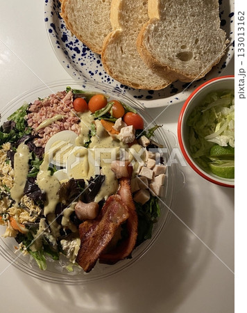 Fresh vegetable salad with a vibrant mix of greens, cherry tomatoes, cucumbers, and bell peppers. Crisp, colorful, and packed with vitamins, this salad makes a healthy, delicious meal or side. Fresh vegetable salad with a vibrant mix of greens, cherry tomatoes, cucumbers, and bell peppers. Crisp, colorful, and packed with vitamins, this salad makes a healthy, delicious meal or side. 133013162