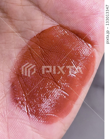 Lipstick swatches on the hand showcasing a range of vibrant shades and finishes, offering a perfect view of color payoff, texture, and undertones in every bold and beautiful swipe. Lipstick swatches on the hand showcasing a range of vibrant shades and finishes, offering a perfect view of color payoff, texture, and undertones in every bold and beautiful swipe. 133013347