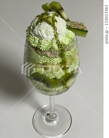 Layered matcha parfait with rich green tea cream, sweet red beans, mochi, and crunchy toppings—offering a perfect balance of earthy bitterness and sweet textures in every delightful spoonful. Layered matcha parfait with rich green tea cream, sweet red beans, mochi, and crunchy toppings—offering a perfect balance of earthy bitterness and sweet textures in every delightful spoonful. 133013361