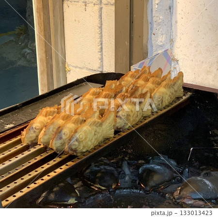 Bungeoppang, bungeo-ppang (Korean Fish Shaped Pastry), popular snack, cookies, sweet in winter streets of Korea. Bungeoppang (붕어빵) - Korean traditional national food, dish, cuisine. Japanese taiyaki 133013423
