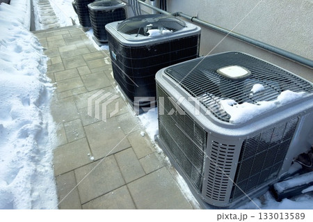 Outdoor HVAC units in winter snow Outdoor HVAC units in winter snow 133013589