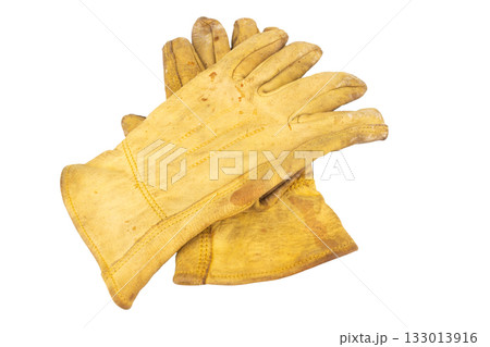 Yellow work gloves Dirty Old isolated on white background Yellow work gloves Dirty Old isolated on white background 133013916