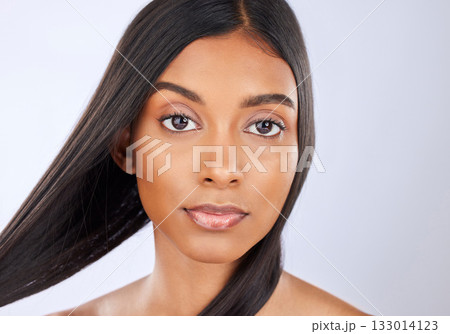 Hair care, salon and portrait of woman with beauty isolated on a white background in a studio. Serious, young and an Indian model with a keratin treatment, straight and silky hairstyle on a backdrop Hair care, salon and portrait of woman with beauty isolated on a white background in a studio. Serious, young and an Indian model with a keratin treatment, straight and silky hairstyle on a backdrop 133014123