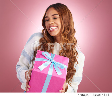 Gift, happy and woman in studio with present for birthday, celebration or prize on pink background. Smile, box and gir winner excited with package, giveaway or party gesture while posing isolated 133014151