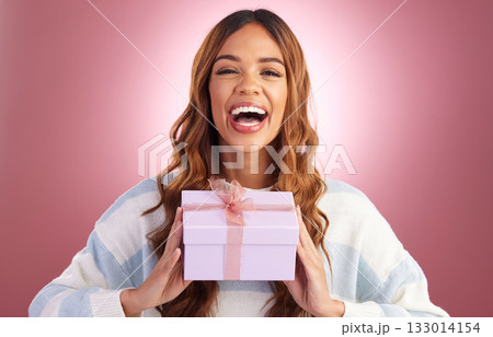 Woman, gift and box in studio portrait with happiness, surprise and celebration by gradient background. Student girl, young and happy with present package, excited face and celebrate for birthday Woman, gift and box in studio portrait with happiness, surprise and celebration by gradient background. Student girl, young and happy with present package, excited face and celebrate for birthday 133014154