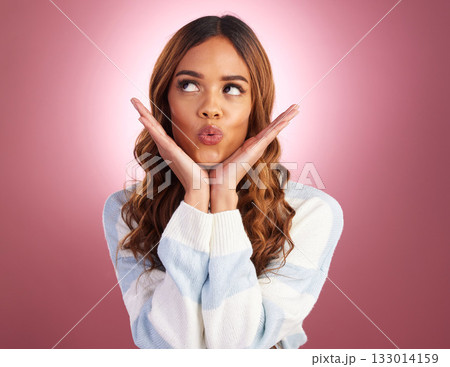 Kiss, face and woman in a studio with funny, silly and emoji expression with a purple background. Female model, youth and happiness of a young and happy person kissing with a pout and casual fashion 133014159