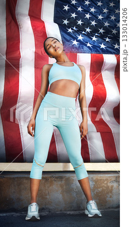 USA, fitness and woman training for sports, race or marathon for the country. Ready, standing and a runner with a flag for running, motivation to win and competition for sport, sprinting or cardio USA, fitness and woman training for sports, race or marathon for the country. Ready, standing and a runner with a flag for running, motivation to win and competition for sport, sprinting or cardio 133014206