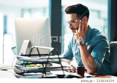 Serious, business man and computer in office for planning startup, online research and reading email report at desk. Focused worker, desktop pc and website connection for project, internet and tech 133014254