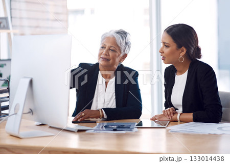 Mentor, coaching or business women with computer talking, speaking or planning a project in office. Technology, teamwork collaboration or senior manager explaining to an intern for digital training 133014438