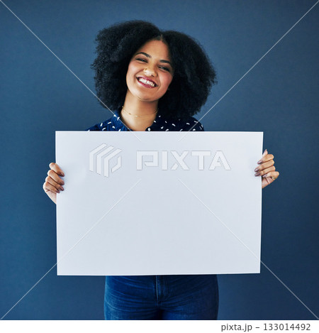 News, mockup and portrait of a woman with a poster isolated on a blue background in studio. Smile, showing and young corporate copywriter with a blank board for branding, design and information space 133014492