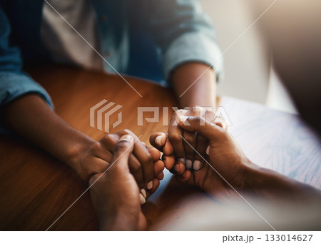 Empathy, prayer and support with friends and holding hands for comfort, kindness and gratitude. Hope, help and trust with closeup of people at home for depression, praying and forgiveness 133014627