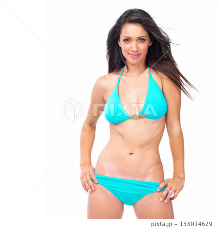 Happy woman, portrait and sexy bikini body with smile isolated against a white studio background. Young, fit and slim female person or model in blue swimsuit and smiling in pose on mockup space Happy woman, portrait and sexy bikini body with smile isolated against a white studio background. Young, fit and slim female person or model in blue swimsuit and smiling in pose on mockup space 133014629