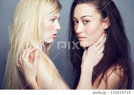 Face, portrait and beauty of women couple in studio for makeup, cosmetics and lgbtq lifestyle. Seductive gay or lesbian people together on a grey background for self love, skin care and natural glow 133014714