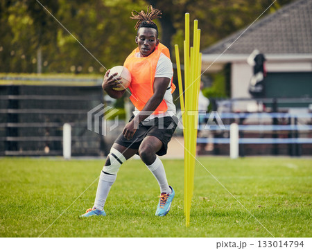 Rugby, sports and black man training with equipment ready for match, practice and sport games. Fitness, performance and serious male athlete running for warm up, exercise and workout for competition 133014794