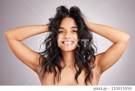 Hair care, happy woman and beauty with portrait, cosmetics and messy hairstyle on studio background. Wellness, shine and female smile, face and cosmetic treatment, keratin and texture with volume 133015050