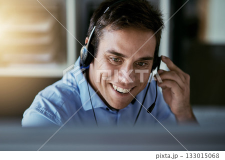 Call center agent, computer and happy man consulting with advice, sales or help desk worker with headset. Phone, conversation and happiness, customer support consultant at crm agency with smile. 133015068