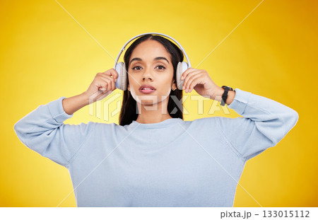 Music, headphones and portrait of woman in studio for streaming, online radio and audio. Relax, media and podcast with female isolated on yellow background for technology, listening and connection Music, headphones and portrait of woman in studio for streaming, online radio and audio. Relax, media and podcast with female isolated on yellow background for technology, listening and connection 133015112