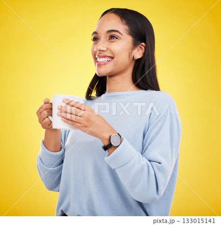 Morning, coffee mug and happy woman in a studio with a smile from espresso. Isolated, yellow background and smile of a young female with happiness and joy ready to start the day with confidence 133015141