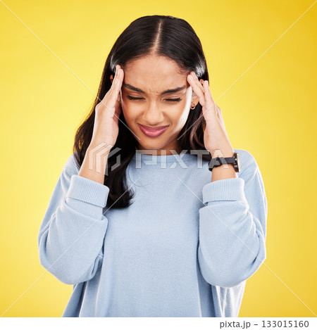 Young woman, stress and burnout with headache, pain and distress isolated on yellow studio background. Female massage temple, mental health and anxiety with depression, frustrated and trauma migraine Young woman, stress and burnout with headache, pain and distress isolated on yellow studio background. Female massage temple, mental health and anxiety with depression, frustrated and trauma migraine 133015160