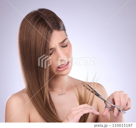 Scissors, beauty and woman cutting hair in studio, trim and split ends removal against a grey background. Haircare, model and girl with tool for tips, styling and hairstyle while posing isolated Scissors, beauty and woman cutting hair in studio, trim and split ends removal against a grey background. Haircare, model and girl with tool for tips, styling and hairstyle while posing isolated 133015197