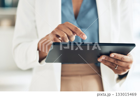 Tablet, typing and hands of woman in office for networking, information and project analysis. Executive, technology and digital with zoom of female browsing online for app, email and connection Tablet, typing and hands of woman in office for networking, information and project analysis. Executive, technology and digital with zoom of female browsing online for app, email and connection 133015469