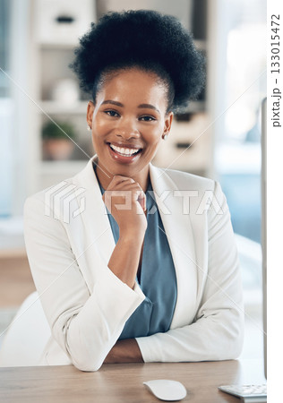 Happy, success and portrait of a black woman in the office with a computer working or doing research. Business, smile and African female corporate manager sitting at her desk with a pc in workplace. 133015472