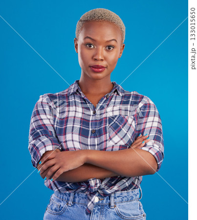 Serious, confidence and portrait of black woman with crossed arms, proud and empowerment in studio. Fashion, beauty and attractive girl on blue background with pride, success mindset and motivation Serious, confidence and portrait of black woman with crossed arms, proud and empowerment in studio. Fashion, beauty and attractive girl on blue background with pride, success mindset and motivation 133015650