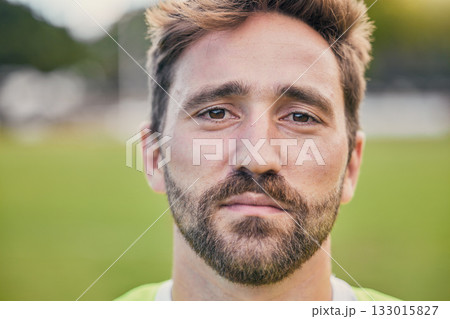 Rugby, field and portrait of man with serious expression, confidence and pride in winning game. Fitness, sports and zoom on face of player ready for match, workout or competition on grass at stadium. Rugby, field and portrait of man with serious expression, confidence and pride in winning game. Fitness, sports and zoom on face of player ready for match, workout or competition on grass at stadium. 133015827