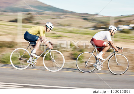 Fitness, cycling and fast with men in park for training, motion blur and cardio workout. Marathon, sports and exercise with cyclists riding on bike for speed, challenge and race for competition Fitness, cycling and fast with men in park for training, motion blur and cardio workout. Marathon, sports and exercise with cyclists riding on bike for speed, challenge and race for competition 133015892