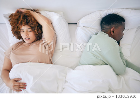 Top view, sleeping and black couple in bed in morning after fighting, argument and relationship problem. Depression, dating and male in bed with woman with sexual frustrated, infertility and stress 133015910