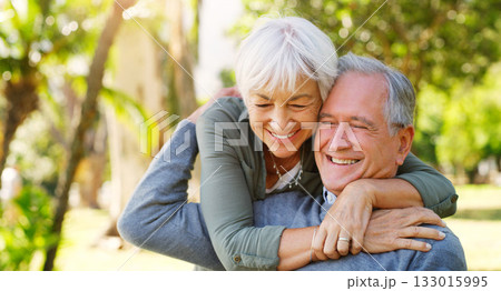 Love, hugging and elderly couple in a garden together with care, happiness and romance. Smile, nature and senior man and woman in retirement embracing, laughing and sitting in an outdoor green park. Love, hugging and elderly couple in a garden together with care, happiness and romance. Smile, nature and senior man and woman in retirement embracing, laughing and sitting in an outdoor green park. 133015995