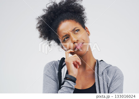 Black woman, serious and isolated thinking of fitness, workout idea or planning exercise and health goals. Girl, think or plan decision for training, gym or remember sport ideas on white background 133016024