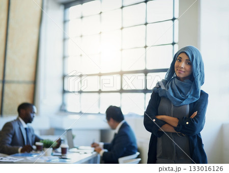 Business woman, muslim and arms crossed portrait in an office with a smile for career pride. Arab female entrepreneur or leader at a diversity and corporate workplace with a positive mindset 133016126