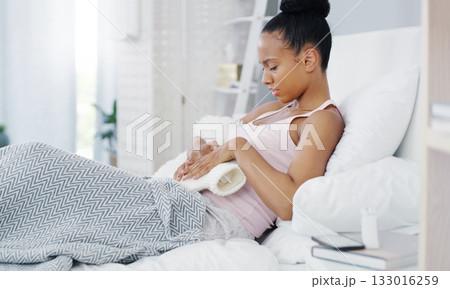 Woman, stomach pain and period cramps, hot water bottle for endometriosis, health problem and sick in bed. Female person with digestion issue at home, warmer to sooth abdominal ache and menstruation 133016259