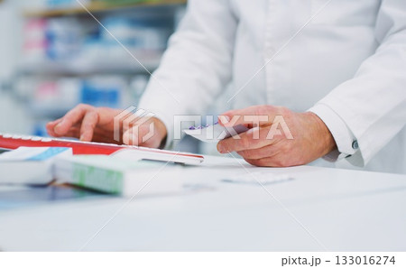 Pharmacy pills, computer keyboard and person hands typing, research and search product info on drugs store database. Dispensary service, hospital medicine and chemist enter supplement information 133016274