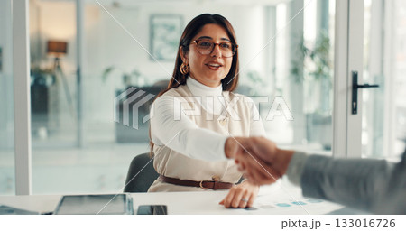Woman, handshake and smile for deal at startup with b2b collaboration, thanks and success at office meeting. Business people, shaking hands or happy for agreement, contract or project at media agency Woman, handshake and smile for deal at startup with b2b collaboration, thanks and success at office meeting. Business people, shaking hands or happy for agreement, contract or project at media agency 133016726