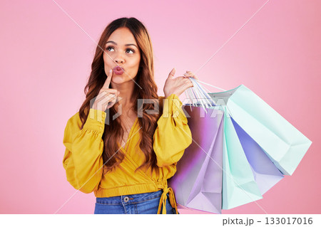 Woman thinking about shopping purchase, paper bag and retail with fashion sale on pink background. Customer experience, service and product choice, thoughtful female in studio and discount at shop Woman thinking about shopping purchase, paper bag and retail with fashion sale on pink background. Customer experience, service and product choice, thoughtful female in studio and discount at shop 133017016