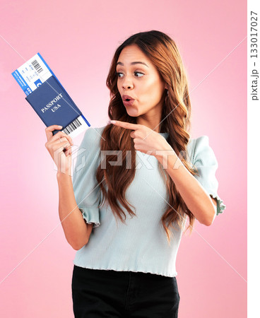 Travel passport, surprise and woman point in studio with ticket, boarding pass and flight documents. Traveling agency mockup, tourism and girl ready for international holiday, vacation and USA trip 133017027