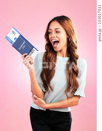 Travel passport, excited and woman with ticket in studio with paper, boarding pass and flight documents. Traveling agency, tourism and happy girl for international holiday, vacation and USA trip 133017031
