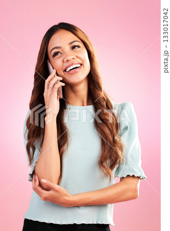 Woman, phone call and happy with communication and technology, casual conversation on pink background. Happiness, young female with smile and connection with network, talking on mobile in studio Woman, phone call and happy with communication and technology, casual conversation on pink background. Happiness, young female with smile and connection with network, talking on mobile in studio 133017042