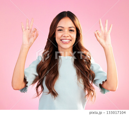 Portrait, studio and woman with a perfect hand gesture, excitement and positive face expression. Happy, smile and young female model from Colombia with a ok sign language isolated by pink background. Portrait, studio and woman with a perfect hand gesture, excitement and positive face expression. Happy, smile and young female model from Colombia with a ok sign language isolated by pink background. 133017104