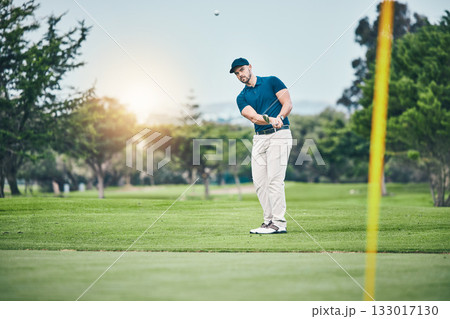Golf, stroke and aim with a sports man swinging a club on a field or course for recreation, fun and hobby. Golfing, grass and training with a male golfer playing a game on a green during summer Golf, stroke and aim with a sports man swinging a club on a field or course for recreation, fun and hobby. Golfing, grass and training with a male golfer playing a game on a green during summer 133017130
