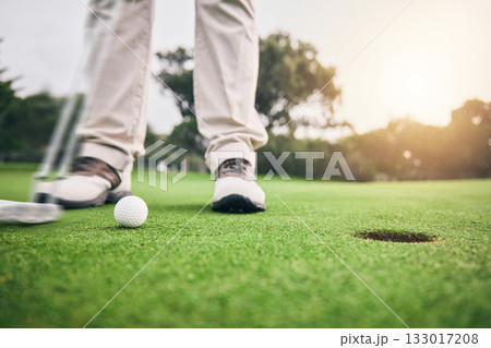 Golf, hole and legs of athlete or player hit ball and professional golfer training and putting on a filed as exercise or workout. Feet, equipment and gentleman or person relax and playing a sport Golf, hole and legs of athlete or player hit ball and professional golfer training and putting on a filed as exercise or workout. Feet, equipment and gentleman or person relax and playing a sport 133017208