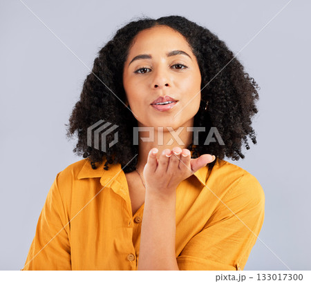 Flirty, happy and a portrait of a woman blowing kiss isolated on a studio background. Love, smile and a flirtatious girl with a loving, cute and romantic gesture on a backdrop for expression Flirty, happy and a portrait of a woman blowing kiss isolated on a studio background. Love, smile and a flirtatious girl with a loving, cute and romantic gesture on a backdrop for expression 133017300