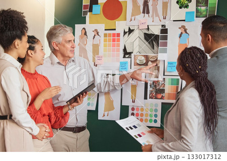 People, ideas or fashion meeting planning clothing, fabrics or boutique clothes with teamwork together. Senior creative designers talking, speaking or working on group vision or strategy in office 133017312