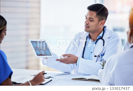Tablet xray, man and doctors in radiology planning for test, results charts and healthcare analysis meeting. Medical team, hospital and digital x ray of skull, anatomy and review neurology technology 133017437