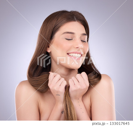 Woman, smile and strong haircare in studio, background and growth results, shine or keratin treatment. Happy female model, long hairstyle and smooth textures for balayage, beauty or shampoo cosmetics 133017645