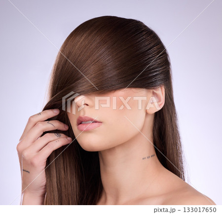 Woman cover face with haircare in studio, background and smooth textures of growth shampoo, cosmetics and wellness. Female model, hairstyle and brunette beauty of keratin, salon treatment and shine Woman cover face with haircare in studio, background and smooth textures of growth shampoo, cosmetics and wellness. Female model, hairstyle and brunette beauty of keratin, salon treatment and shine 133017650