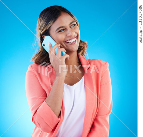 Phone call, conversation and smile of business woman talking, chatting or communication in studio isolated on a blue background. Cellphone, contact and happy Indian female in discussion or speaking. 133017686